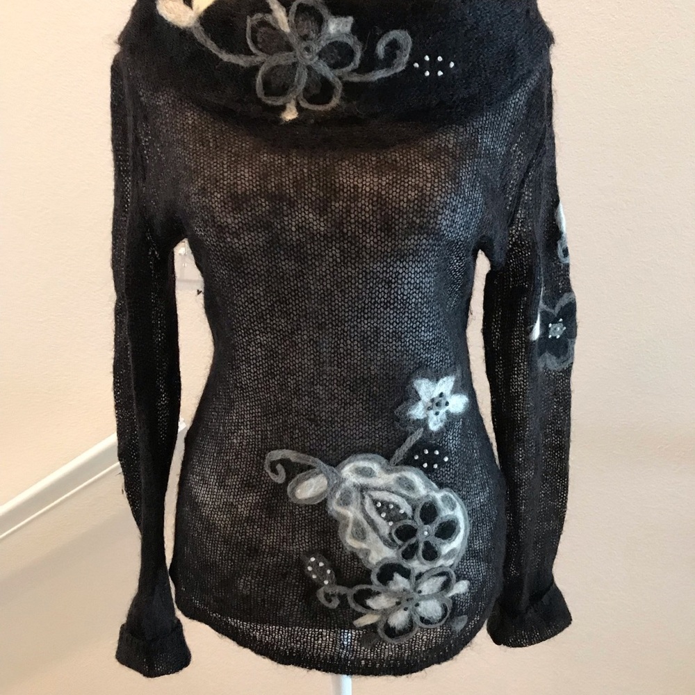 European made long sleeve knit turtleneck sweater. Size medium.